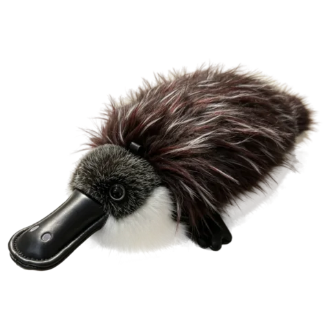 Platy the platypus plush from the side, showing the flat bill, low body and broad tail